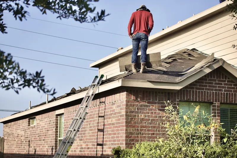 Professional roofer working on a residential roof in Dutch Flat